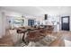 Bright dining room features stylish table, seating, and easy access to the kitchen and living room at 3231 W Willow Ave, Phoenix, AZ 85029