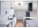 Modern kitchen featuring new cabinetry, countertops, and an island cooktop, perfect for cooking at 3231 W Willow Ave, Phoenix, AZ 85029