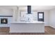 Modern kitchen features a large island, stainless steel appliances, and contemporary design at 3231 W Willow Ave, Phoenix, AZ 85029