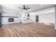 Spacious living room with fireplace, new floors, and easy access to the modern kitchen at 3231 W Willow Ave, Phoenix, AZ 85029