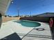 A refreshing pool surrounded by a white deck invites relaxation and enjoyment in the home's backyard at 3231 W Willow Ave, Phoenix, AZ 85029