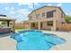 Inviting backyard features a sparkling pool, hot tub, and covered patio, perfect for entertaining at 3370 E Flamingo Ct, Gilbert, AZ 85297