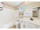 Clean, well-maintained bathroom featuring a tub and shower combo with a large mirror and a white vanity at 3370 E Flamingo Ct, Gilbert, AZ 85297