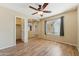 Comfortable bedroom with wood floors and a view to the hallway at 3370 E Flamingo Ct, Gilbert, AZ 85297