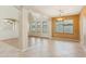 Dining room with tile and wood flooring, bright lighting and natural light at 3370 E Flamingo Ct, Gilbert, AZ 85297