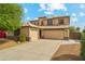 Charming two-story home with a three car garage and beautiful desert landscaping at 3370 E Flamingo Ct, Gilbert, AZ 85297