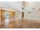 Spacious living room with tile and wood flooring, and staircase access at 3370 E Flamingo Ct, Gilbert, AZ 85297