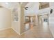 Open concept living room with arched doorways and wood flooring at 3370 E Flamingo Ct, Gilbert, AZ 85297