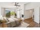 Serene bedroom featuring a sliding glass door, modern decor, and a cozy fireplace at 3370 E Flamingo Ct, Gilbert, AZ 85297