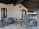 Community outdoor covered patio with lounge seating, a bar, and views of the community pool area at 3626 E Audrey Dr, San Tan Valley, AZ 85143