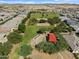 Birds eye view of the community park featuring green space, playground and walking paths near neighborhood homes at 37084 W Prado St, Maricopa, AZ 85138