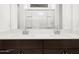 Well lit, modern bathroom features double sinks, contemporary fixtures, and a sleek design at 37084 W Prado St, Maricopa, AZ 85138