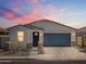 Beautiful one-story home featuring a two-car garage, neutral color palette, and landscaped front yard at 37084 W Prado St, Maricopa, AZ 85138