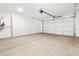 Spacious two car garage with ample space for vehicles and storage at 37084 W Prado St, Maricopa, AZ 85138