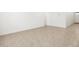 Bright living space features tile floors, neutral walls, and a minimalist design at 37084 W Prado St, Maricopa, AZ 85138
