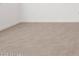 A bright, neutral-toned space featuring seamless tile flooring and freshly painted white walls at 37084 W Prado St, Maricopa, AZ 85138