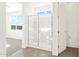 Bathroom featuring a glass shower and tiled floors at 37111 W Prado St, Maricopa, AZ 85138