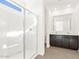 Bathroom showcasing glass shower, dark wood cabinets, and tiled floors at 37111 W Prado St, Maricopa, AZ 85138