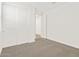 Bedroom with gray carpet and closet featuring bright white double doors at 37111 W Prado St, Maricopa, AZ 85138