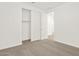 Bedroom with large closet, white baseboards, and gray carpet at 37111 W Prado St, Maricopa, AZ 85138