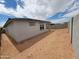 New construction backyard featuring a covered patio and cinder block wall at 37112 W Prado St, Maricopa, AZ 85138