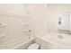 Bright bathroom featuring a shower-tub combo, single sink vanity, and toilet at 37112 W Prado St, Maricopa, AZ 85138