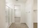 Bathroom featuring walk-in shower, linen closet and a view into the bedroom at 37112 W Prado St, Maricopa, AZ 85138