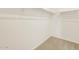 Bright walk-in closet with neutral carpet and white walls at 37112 W Prado St, Maricopa, AZ 85138