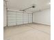 Spacious garage with a large roll up door and ample parking space at 37112 W Prado St, Maricopa, AZ 85138