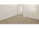 A room featuring neutral carpeting and bright doors at 37112 W Prado St, Maricopa, AZ 85138