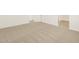 A room featuring neutral carpeting and tile flooring at 37112 W Prado St, Maricopa, AZ 85138