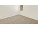 The room boasts neutral carpeting and natural light at 37112 W Prado St, Maricopa, AZ 85138