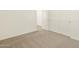 A room featuring neutral carpeting and white doors at 37112 W Prado St, Maricopa, AZ 85138