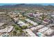 Stunning aerial view of a desert community featuring beautiful homes and desert landscaping with mountain views at 37300 N Tom Darlington Dr # D, Carefree, AZ 85377