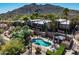 Stunning aerial view of a luxury home with a sparkling pool and mountain backdrop at 37300 N Tom Darlington Dr # D, Carefree, AZ 85377