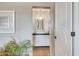 View of charming bathroom featuring a single sink, hanging light fixture, and tile flooring at 37300 N Tom Darlington Dr # D, Carefree, AZ 85377