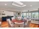 Open dining room with stylish furnishings and abundant natural light, with view to fireplace at 37300 N Tom Darlington Dr # D, Carefree, AZ 85377