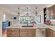 Kitchen island with granite countertops, stainless appliances, and view to the dining room at 37300 N Tom Darlington Dr # D, Carefree, AZ 85377