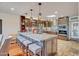 Spacious kitchen with large island, granite countertops, stainless appliances, and ample cabinet space at 37300 N Tom Darlington Dr # D, Carefree, AZ 85377