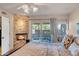Elegant main bedroom showcases a fireplace, king-size bed, and sliding door access to the patio at 37300 N Tom Darlington Dr # D, Carefree, AZ 85377