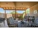 Inviting covered patio with comfortable seating and desert landscape at 37300 N Tom Darlington Dr # D, Carefree, AZ 85377