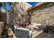 Inviting outdoor patio with comfortable seating and a built-in grill at 37300 N Tom Darlington Dr # D, Carefree, AZ 85377