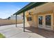 Covered back patio with ceiling fan and outdoor lighting at 4007 W Thunderbird Rd, Phoenix, AZ 85053