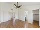 Bedroom features wood floors, neutral walls, and double door entry to bath at 4007 W Thunderbird Rd, Phoenix, AZ 85053