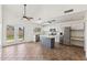 Bright kitchen featuring stainless steel appliances, kitchen island and access to the backyard through french doors at 4007 W Thunderbird Rd, Phoenix, AZ 85053
