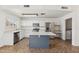 Bright kitchen featuring stainless appliances, white cabinets, tile floor and island at 4007 W Thunderbird Rd, Phoenix, AZ 85053