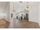 Open-concept kitchen with stainless steel appliances, a center island, and ample natural light at 4007 W Thunderbird Rd, Phoenix, AZ 85053