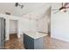 Spacious kitchen features a central island, tile floors, and modern lighting at 4007 W Thunderbird Rd, Phoenix, AZ 85053