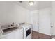 Bright laundry room with tile floors features a washer and dryer at 4007 W Thunderbird Rd, Phoenix, AZ 85053