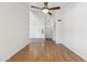 Bright living room featuring hardwood flooring, modern lighting, and a view to the rest of the house at 4007 W Thunderbird Rd, Phoenix, AZ 85053